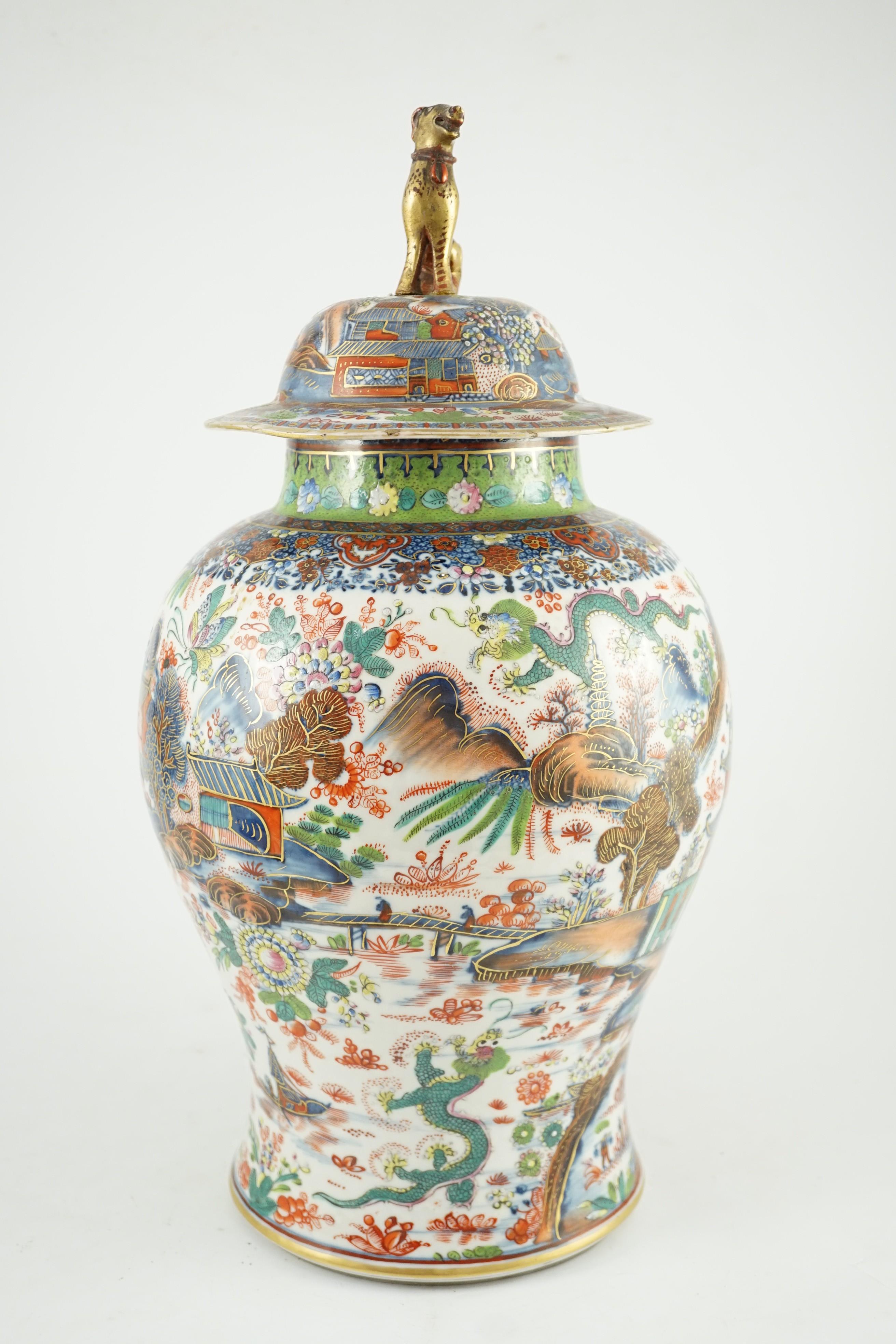 A Chinese clobbered blue and white vase and cover, 18th/19th century, 47cm high